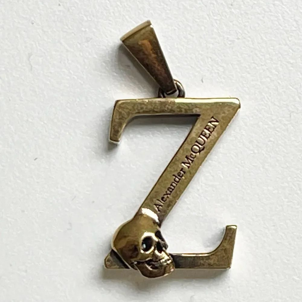 Alexander McQueen Z with scull necklace or zipper charm. One charm.